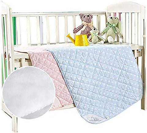 a baby crib with a blanket and teddy bears